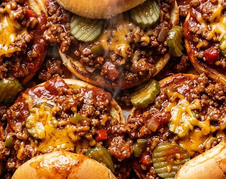 Easy Sloppy Joes Recipe for Quick Family Meals Easy sloppy joes recipe sandwiches with cheesy beef and pickles on soft toasted buns.